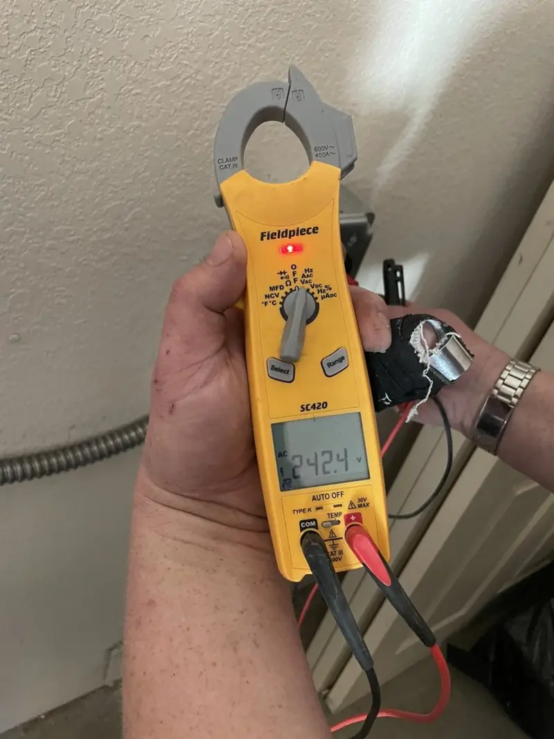 Voltage testing with clamp meter during Aluminum Wiring Replacement in Lincoln Park